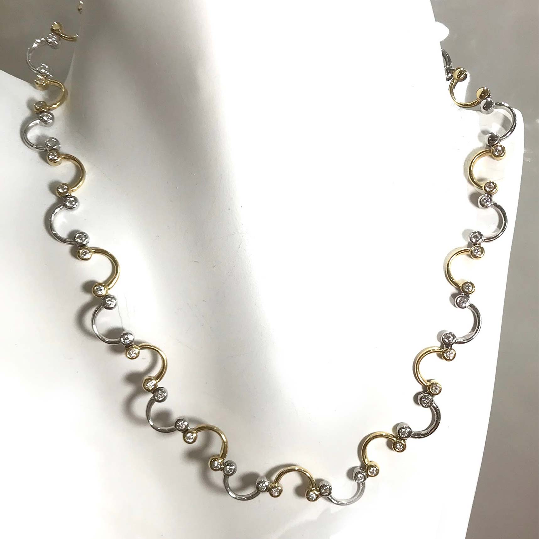 https://robertandgabriel.com/wp-content/uploads/2020/06/Diamond-Swirl-Design-Handmade-Necklace.jpg